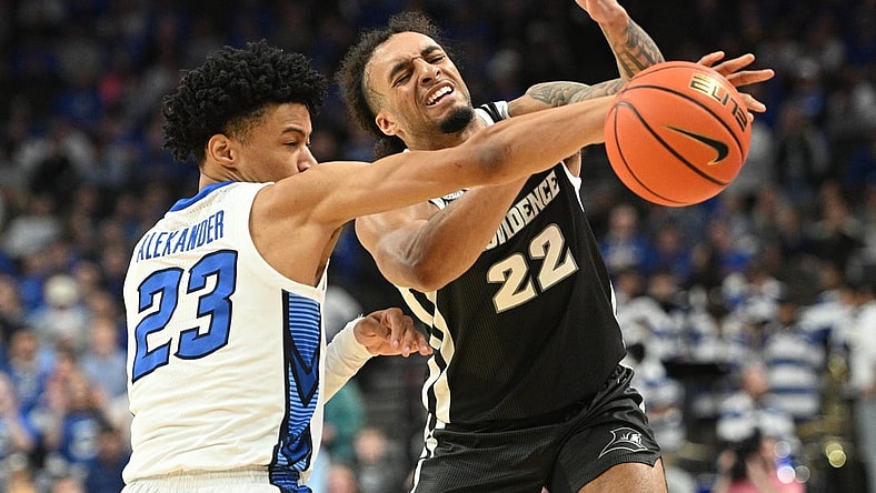 Jan 6, 2024; Omaha, Nebraska, USA; Creighton Bluejays guard Trey Alexander (23) fouls Providence Friars guard Devin Carter (22) on an attempted steal in the first half at CHI Health Center Omaha. Mandatory Credit: Steven Branscombe-USA TODAY Sports
