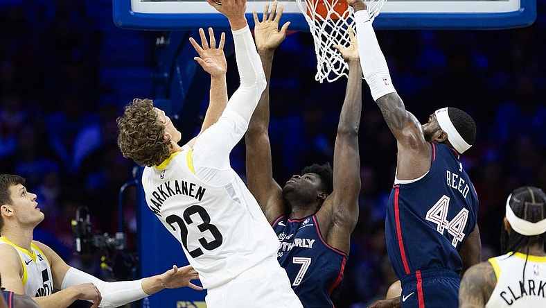 Jan 6, 2024; Philadelphia, Pennsylvania, USA; Utah Jazz forward Lauri Markkanen (23) scores past Philadelphia 76ers center Mo Bamba (7) and forward Paul Reed (44) during the first quarter at Wells Fargo Center. Mandatory Credit: Bill Streicher-USA TODAY Sports