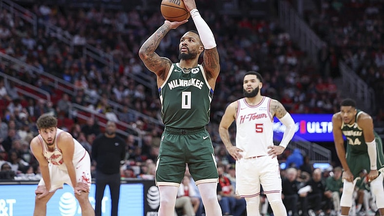 Jan 6, 2024; Houston, Texas, USA; Milwaukee Bucks guard Damian Lillard (0) attempts a free throw during the second quarter against the Houston Rockets at Toyota Center. Mandatory Credit: Troy Taormina-USA TODAY Sports