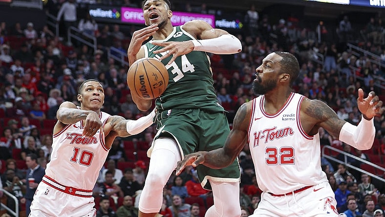 Jan 6, 2024; Houston, Texas, USA; Milwaukee Bucks forward Giannis Antetokounmpo (34) attempts to control the ball as Houston Rockets forward Jabari Smith Jr. (10) defends during the second quarter at Toyota Center. Mandatory Credit: Troy Taormina-USA TODAY Sports