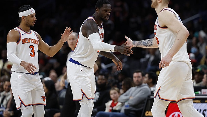 Jan 6, 2024; Washington, District of Columbia, USA; New York Knicks forward Julius Randle (30) celebrates on the court with Knicks center Isaiah Hartenstein (55) and Knicks guard Josh Hart (3) against the Washington Wizards in the fourth quarter at Capital One Arena. Mandatory Credit: Geoff Burke-USA TODAY Sports