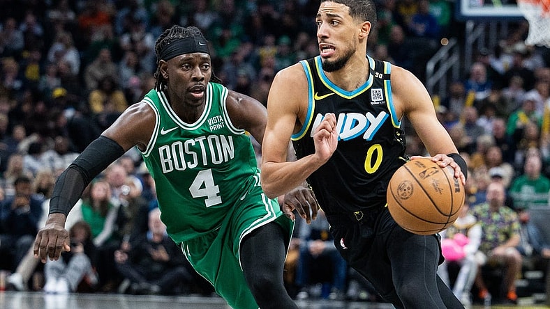 Jan 6, 2024; Indianapolis, Indiana, USA; Indiana Pacers guard Tyrese Haliburton (0) dribbles the ball against Boston Celtics guard Jrue Holiday (4) in the second half at Gainbridge Fieldhouse. Mandatory Credit: Trevor Ruszkowski-USA TODAY Sports