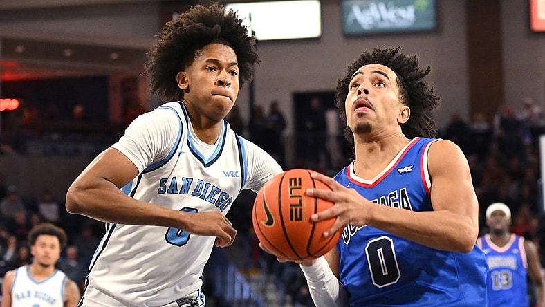 Jan 6, 2024; Spokane, Washington, USA; Gonzaga Bulldogs guard Ryan Nembhard (0) shoots the ball against San Diego Toreros guard Kevin Patton Jr. (0) in the second half at McCarthey Athletic Center. Gonzaga won 101-74. Mandatory Credit: James Snook-USA TODAY Sports