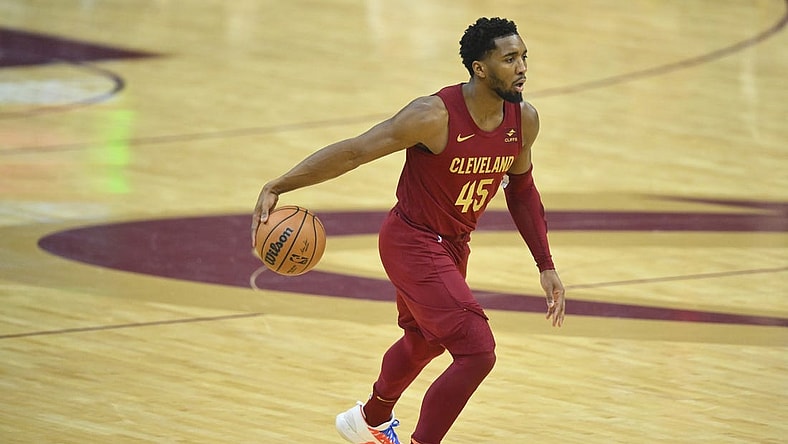 Jan 7, 2024; Cleveland, Ohio, USA; Cleveland Cavaliers guard Donovan Mitchell (45) dribbles the ball in the first quarter against the San Antonio Spurs at Rocket Mortgage FieldHouse. Mandatory Credit: David Richard-USA TODAY Sports