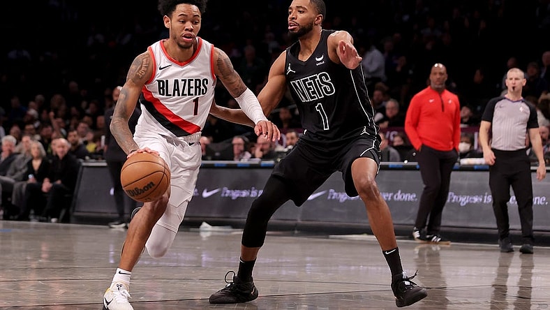 Jan 7, 2024; Brooklyn, New York, USA; Portland Trail Blazers guard Anfernee Simons (1) drives to the basket against Brooklyn Nets forward Mikal Bridges (1) during the first quarter at Barclays Center. Mandatory Credit: Brad Penner-USA TODAY Sports