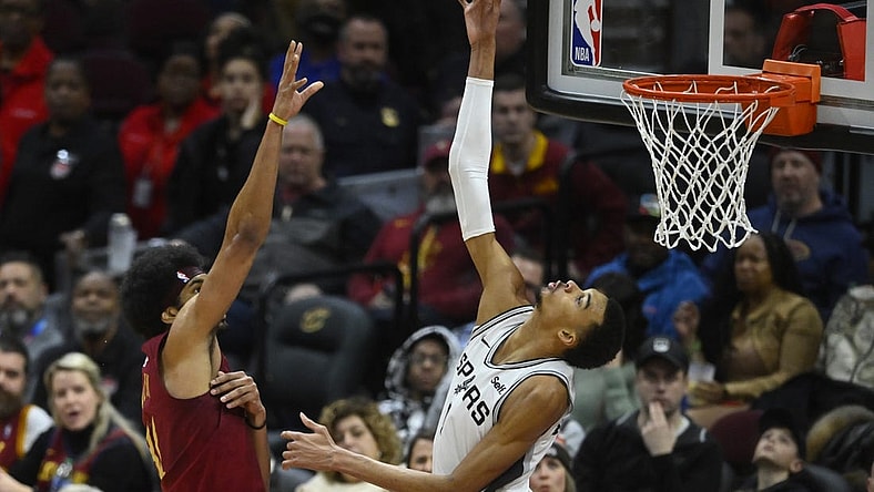 Jan 7, 2024; Cleveland, Ohio, USA; San Antonio Spurs center Victor Wembanyama (1) blocks a shot by Cleveland Cavaliers center Jarrett Allen (31) in the fourth quarter at Rocket Mortgage FieldHouse. Mandatory Credit: David Richard-USA TODAY Sports