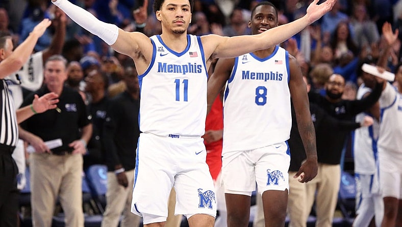 Jan 7, 2024; Memphis, Tennessee, USA; Memphis Tigers guard Jahvon Quinerly (11) reacts after making a three point shot with 3.2 seconds left during the second half against the Southern Methodist Mustangs at FedExForum. Mandatory Credit: Petre Thomas-USA TODAY Sports
