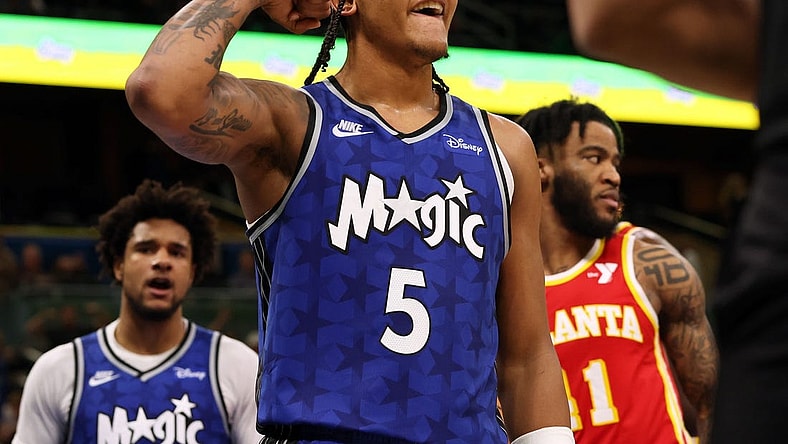 Jan 7, 2024; Orlando, Florida, USA; Orlando Magic forward Paolo Banchero (5) celebrates after he made  basket  against the Atlanta Hawks during overtime at Kia Center. Mandatory Credit: Kim Klement Neitzel-USA TODAY Sports