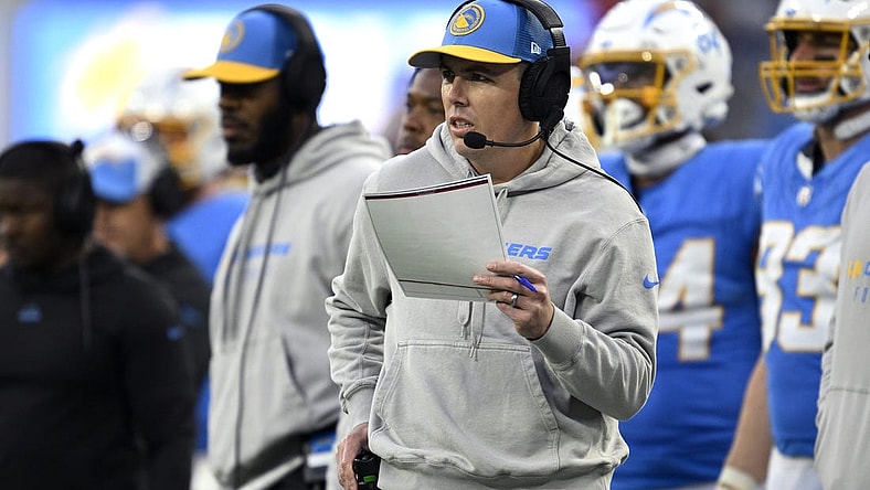Jan 7, 2024; Inglewood, California, USA; Los Angeles Chargers offensive coordinator Kellen Moore looks on during the second half against the Kansas City Chiefs at SoFi Stadium. Mandatory Credit: Orlando Ramirez-USA TODAY Sports