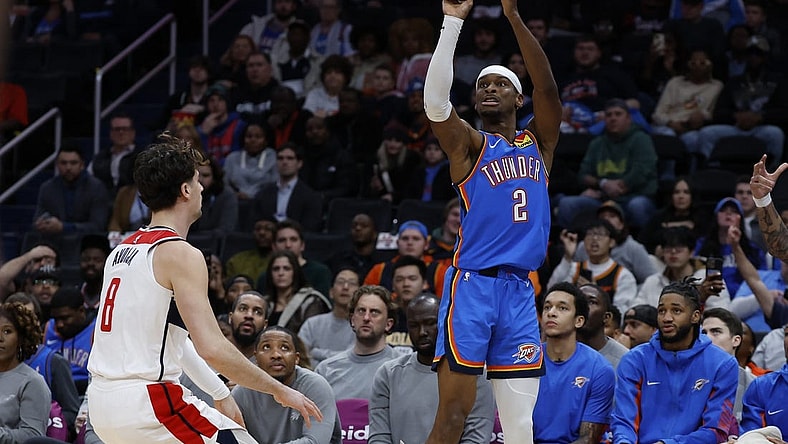 Jan 8, 2024; Washington, District of Columbia, USA; Oklahoma City Thunder guard Shai Gilgeous-Alexander (2) shoots the ball over Washington Wizards forward Deni Avdija (8) in the first quarter at Capital One Arena. Mandatory Credit: Geoff Burke-USA TODAY Sports