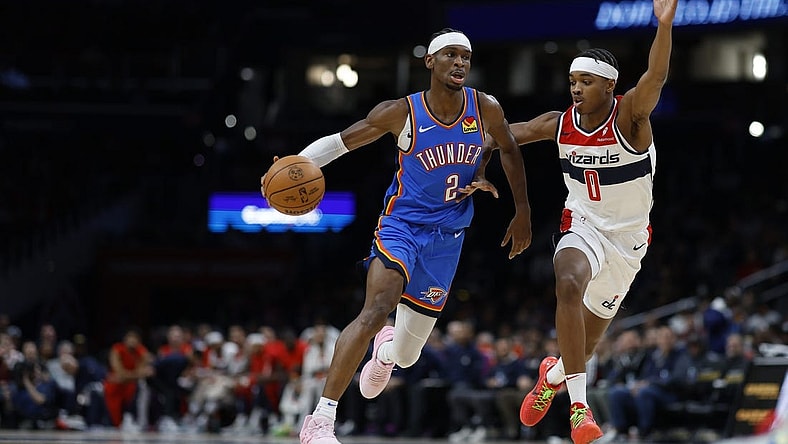 Jan 8, 2024; Washington, District of Columbia, USA; Oklahoma City Thunder guard Shai Gilgeous-Alexander (2) drives to the basket as Washington Wizards guard Bilal Coulibaly (0) defends in the second quarter at Capital One Arena. Mandatory Credit: Geoff Burke-USA TODAY Sports