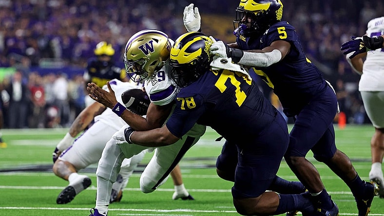 Jan 8, 2024; Houston, TX, USA; Michigan Wolverines defensive lineman Kenneth Grant (78) sakes Washington Huskies quarterback Michael Penix Jr. (9) during the second quarter in the 2024 College Football Playoff national championship game at NRG Stadium. Mandatory Credit: Troy Taormina-USA TODAY Sports