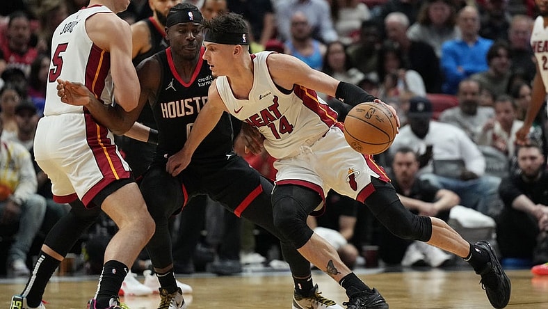 Jan 8, 2024; Miami, Florida, USA;  Miami Heat guard Tyler Herro (14) drives toward the basket against the Houston Rockets during the first half at Kaseya Center. Mandatory Credit: Jim Rassol-USA TODAY Sports