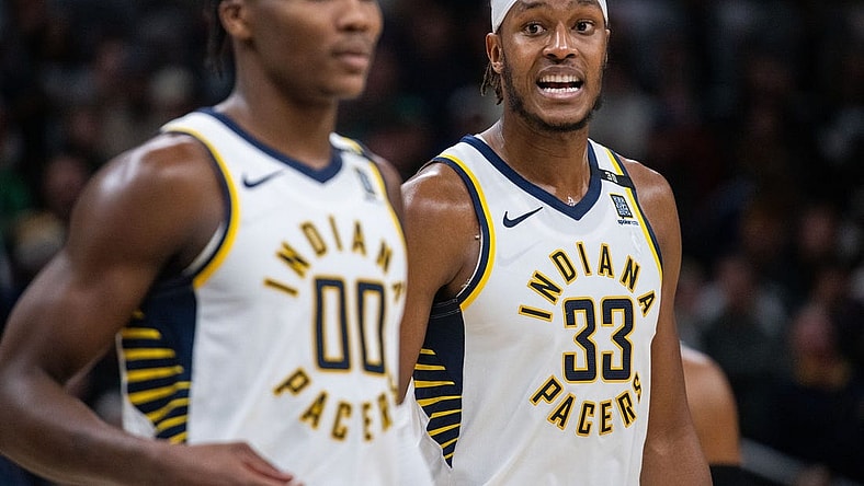 Jan 8, 2024; Indianapolis, Indiana, USA; Indiana Pacers center Myles Turner (33) talks to guard Bennedict Mathurin (00) after a timeout  in the second half against the Boston Celtics at Gainbridge Fieldhouse. Mandatory Credit: Trevor Ruszkowski-USA TODAY Sports
