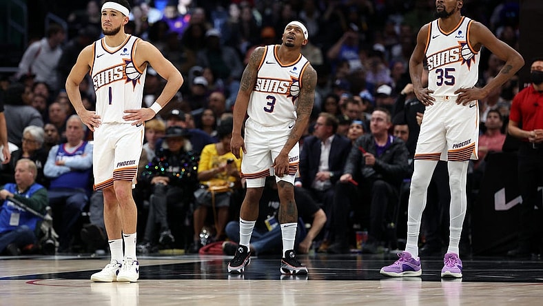 Jan 8, 2024; Los Angeles, California, USA;  Phoenix Suns guard Devin Booker (1) and guard Bradley Beal (3) and forward Kevin Durant (35) stands on the floor during the fourth quarter against the Los Angeles Clippers at Crypto.com Arena. Mandatory Credit: Kiyoshi Mio-USA TODAY Sports