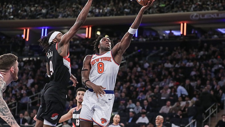 Jan 9, 2024; New York, New York, USA; New York Knicks forward OG Anunoby (8) drives past Portland Trail Blazers forward Jerami Grant (9) for a layup in the third quarter at Madison Square Garden. Mandatory Credit: Wendell Cruz-USA TODAY Sports