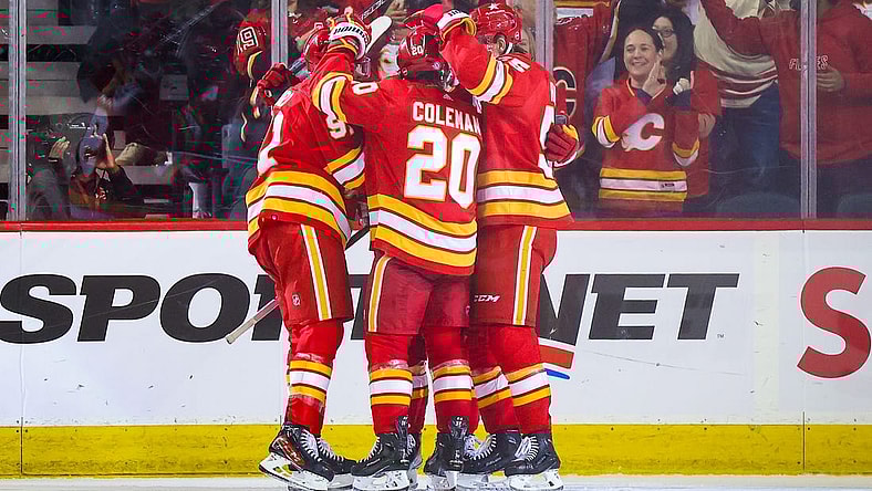 Jan 9, 2024; Calgary, Alberta, CAN; Calgary Flames center Blake Coleman (20) celebrates his goal with teammates against the Ottawa Senators during the third period at Scotiabank Saddledome. Mandatory Credit: Sergei Belski-USA TODAY Sports