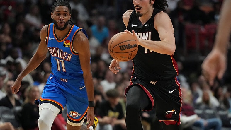 Jan 10, 2024; Miami, Florida, USA; Miami Heat guard Jaime Jaquez Jr. (11) brings the ball up the court against the Oklahoma City Thunder during the first half at Kaseya Center. Mandatory Credit: Jim Rassol-USA TODAY Sports