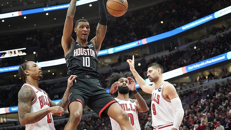Jan 10, 2024; Chicago, Illinois, USA; Houston Rockets forward Jabari Smith Jr. (10) dunks the ball on Chicago Bulls forward DeMar DeRozan (11) during the first quarter at United Center. Mandatory Credit: David Banks-USA TODAY Sports