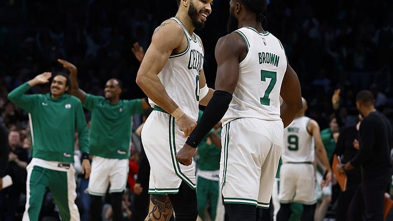 Jan 10, 2024; Boston, Massachusetts, USA; Boston Celtics forward Jayson Tatum (0) and guard Jaylen Brown (7) celebrate during overtime of their 127-120 win over the Minnesota Timberwolves  at TD Garden. Mandatory Credit: Winslow Townson-USA TODAY Sports