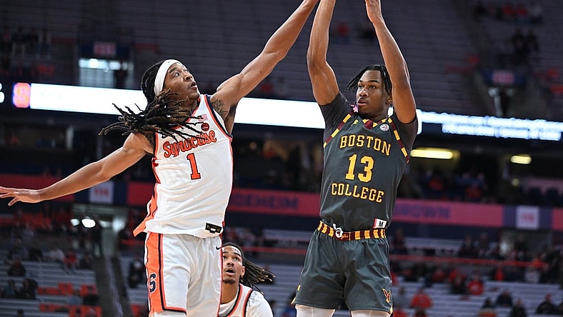 Jan 10, 2024; Syracuse, New York, USA; Syracuse Orange forward Maliq Brown (1) blocks a shot by Boston College Eagles guard Donald Hand Jr. (13) in the first half at the JMA Wireless Dome. Mandatory Credit: Mark Konezny-USA TODAY Sports