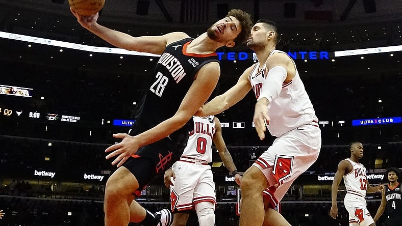 Jan 10, 2024; Chicago, Illinois, USA; Chicago Bulls center Nikola Vucevic (9) fouls Houston Rockets center Alperen Sengun (28) during the second half at United Center. Mandatory Credit: David Banks-USA TODAY Sports