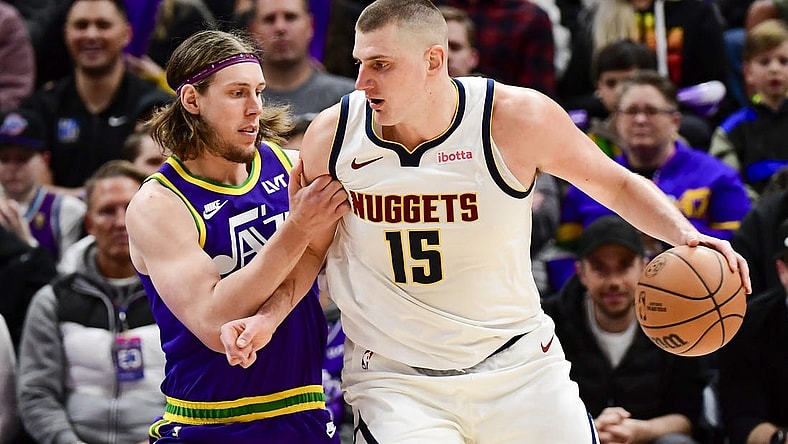 Jan 10, 2024; Salt Lake City, Utah, USA; Utah Jazz forward/center Kelly Olynyk (41) defends Denver Nuggets center Nikola Jokic (15) during the second half at the Delta Center. Mandatory Credit: Christopher Creveling-USA TODAY Sports