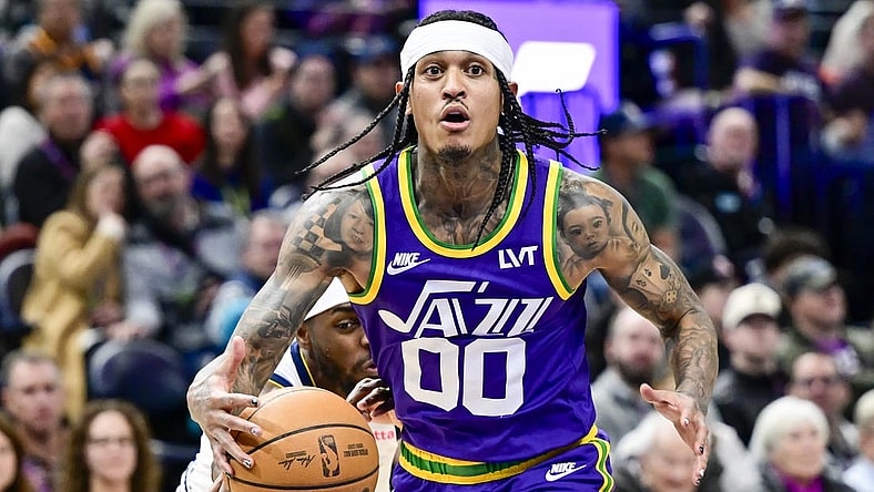 Jan 10, 2024; Salt Lake City, Utah, USA; Denver Nuggets forward/guard Justin Holiday (9) reaches for the ball by Utah Jazz guard Jordan Clarkson (00) during the second half at the Delta Center. Mandatory Credit: Christopher Creveling-USA TODAY Sports