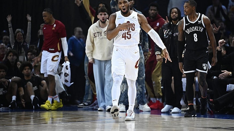 Jan 11, 2024; Paris, FRANCE; Cleveland Cavaliers guard Donovan Mitchell (45) celebrates a three pointer against the Brooklyn Nets in the NBA Paris Game at AccorHotels Arena. Mandatory Credit:  Alexis Reau/Presse Sports via USA TODAY Sports