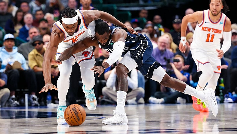 Jan 11, 2024; Dallas, Texas, USA; New York Knicks forward Precious Achiuwa (5) and Dallas Mavericks forward Tim Hardaway Jr. (10) go for a loose ball during the first half at American Airlines Center. Mandatory Credit: Kevin Jairaj-USA TODAY Sports