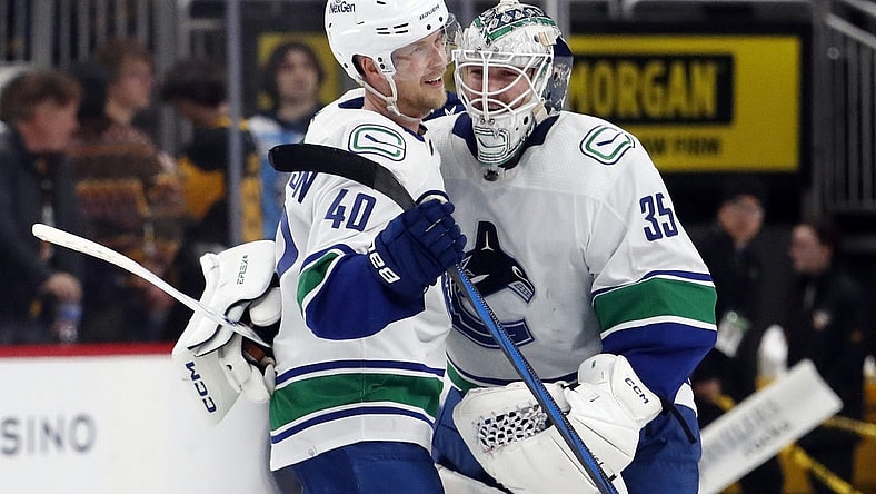Jan 11, 2024; Pittsburgh, Pennsylvania, USA; Vancouver Canucks center Elias Pettersson (40) and goaltender Thatcher Demko (35) celebrate after defeating the Pittsburgh Penguins in overtime at PPG Paints Arena. The Canucks won 4-3 in overtime. Mandatory Credit: Charles LeClaire-USA TODAY Sports
