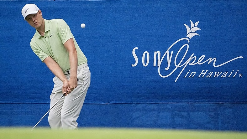 January 11, 2024; Honolulu, Hawaii, USA; Cam Davis hits his chip shot on the 17th hole during the first round of the Sony Open in Hawaii golf tournament at Waialae Country Club. Mandatory Credit: Kyle Terada-USA TODAY Sports