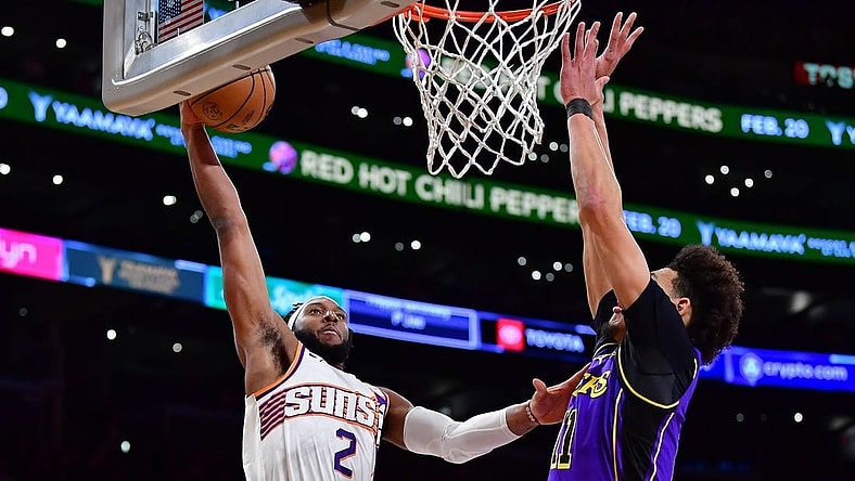 Jan 11, 2024; Los Angeles, California, USA; Phoenix Suns forward Josh Okogie (2) dunks for the basket against Los Angeles Lakers center Jaxson Hayes (11) during the first half at Crypto.com Arena. Mandatory Credit: Gary A. Vasquez-USA TODAY Sports
