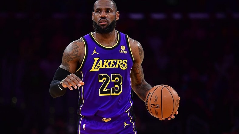 Jan 11, 2024; Los Angeles, California, USA; Los Angeles Lakers forward LeBron James (23) controls the ball against the Phoenix Suns during the second half at Crypto.com Arena. Mandatory Credit: Gary A. Vasquez-USA TODAY Sports