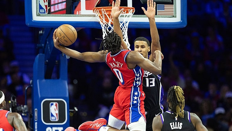 Jan 12, 2024; Philadelphia, Pennsylvania, USA; Philadelphia 76ers guard Tyrese Maxey (0) drives for a score against Sacramento Kings forward Keegan Murray (13) during the second quarter at Wells Fargo Center. Mandatory Credit: Bill Streicher-USA TODAY Sports