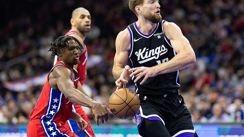 Jan 12, 2024; Philadelphia, Pennsylvania, USA; Philadelphia 76ers guard Tyrese Maxey (0) knocks the ball away from Sacramento Kings forward Domantas Sabonis (10) during the second quarter at Wells Fargo Center. Mandatory Credit: Bill Streicher-USA TODAY Sports