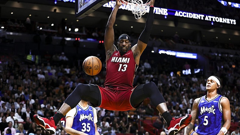 Jan 12, 2024; Miami, Florida, USA; Miami Heat center Bam Adebayo (13) dunks the basketball against the Orlando Magic during the second quarter at Kaseya Center. Mandatory Credit: Sam Navarro-USA TODAY Sports
