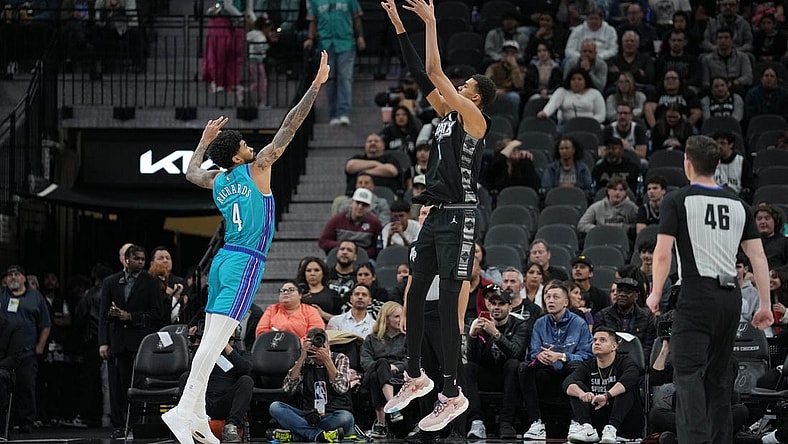 Jan 12, 2024; San Antonio, Texas, USA;  San Antonio Spurs center Victor Wembanyama (1) shoots over Charlotte Hornets center Nick Richards (4) in the first half at Frost Bank Center. Mandatory Credit: Daniel Dunn-USA TODAY Sports