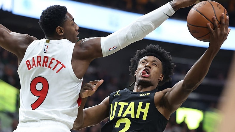 Jan 12, 2024; Salt Lake City, Utah, USA; Utah Jazz guard Collin Sexton (2) goes to the basket against Toronto Raptors guard RJ Barrett (9) during the first quarter at Delta Center. Mandatory Credit: Rob Gray-USA TODAY Sports