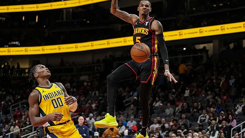 Jan 12, 2024; Atlanta, Georgia, USA; Atlanta Hawks guard Dejounte Murray (5) dunks the ball against the Indiana Pacers during the second half at State Farm Arena. Mandatory Credit: Dale Zanine-USA TODAY Sports