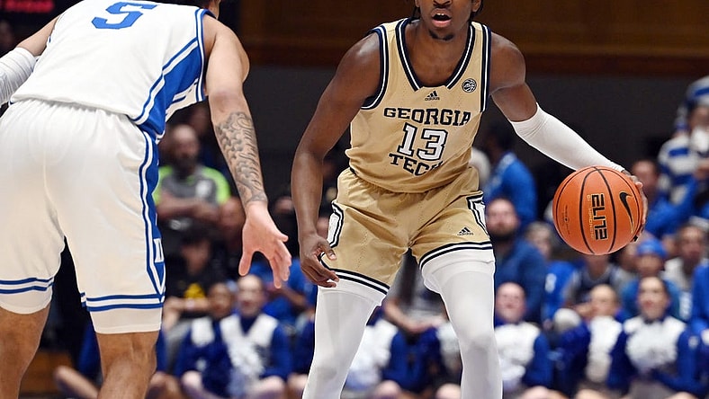 Jan 13, 2024; Durham, North Carolina, USA; Georgia Tech Yellow Jackets guard Miles Kelly (13) controls the ball against Duke Blue Devils guard Tyrese Proctor (5) during the first half at Cameron Indoor Stadium. Mandatory Credit: Rob Kinnan-USA TODAY Sports