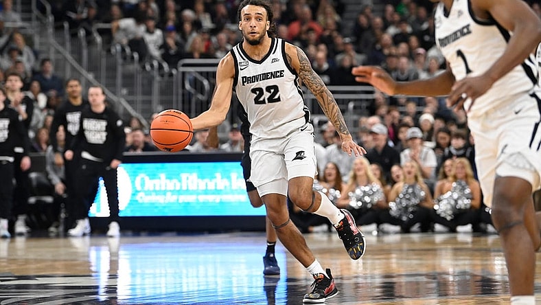 Jan 13, 2024; Providence, Rhode Island, USA; Providence Friars guard Devin Carter (22) passes the ball against the Xavier Musketeers during the first half at Amica Mutual Pavilion. Mandatory Credit:Eric Canha-USA TODAY Sports