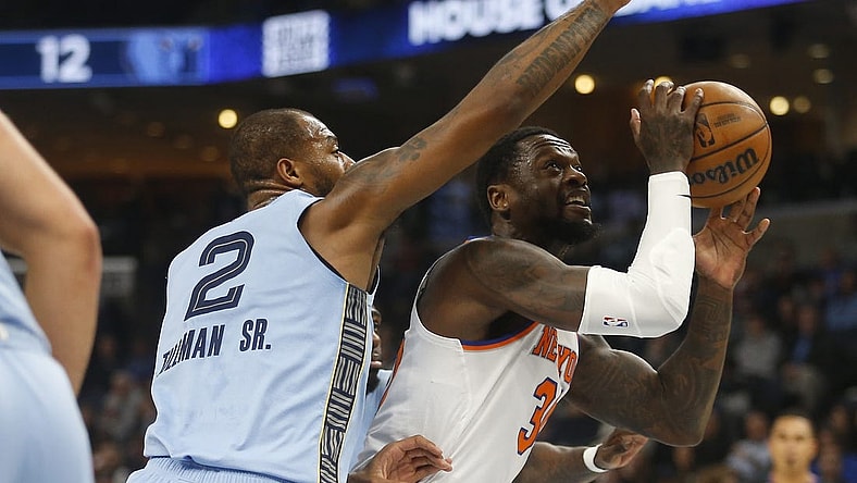 Jan 13, 2024; Memphis, Tennessee, USA; New York Knicks forward Julius Randle (30) drives to the basket as Memphis Grizzlies forward Xavier Tillman (2) defends during the first half at FedExForum. Mandatory Credit: Petre Thomas-USA TODAY Sports