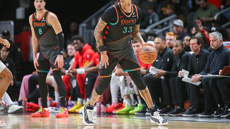 Jan 13, 2024; Atlanta, Georgia, USA; Washington Wizards forward Kyle Kuzma (33) dribbles against the Atlanta Hawks in the second quarter at State Farm Arena. Mandatory Credit: Brett Davis-USA TODAY Sports