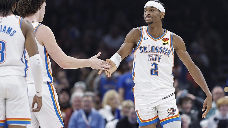 Jan 13, 2024; Oklahoma City, Oklahoma, USA; Oklahoma City Thunder guard Shai Gilgeous-Alexander (2) celebrates with guard Josh Giddey (3) after scoring against the Orlando Magic during the second quarter at Paycom Center. Mandatory Credit: Alonzo Adams-USA TODAY Sports