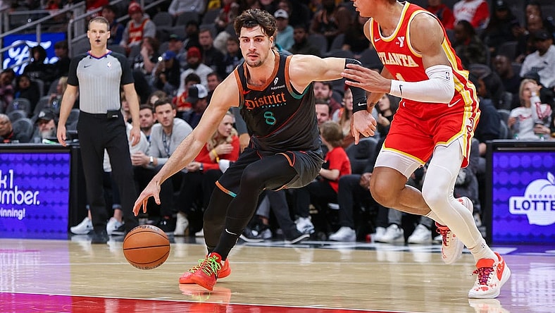 Jan 13, 2024; Atlanta, Georgia, USA; Washington Wizards forward Deni Avdija (8) drives on Atlanta Hawks forward Jalen Johnson (1) in the second half at State Farm Arena. Mandatory Credit: Brett Davis-USA TODAY Sports