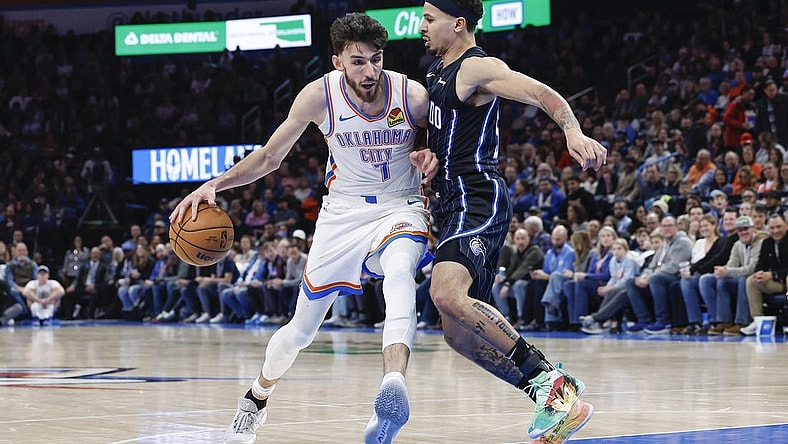Jan 13, 2024; Oklahoma City, Oklahoma, USA; Oklahoma City Thunder forward Chet Holmgren (7) drives to the basket against Orlando Magic guard Cole Anthony (50) during the second half at Paycom Center. Mandatory Credit: Alonzo Adams-USA TODAY Sports