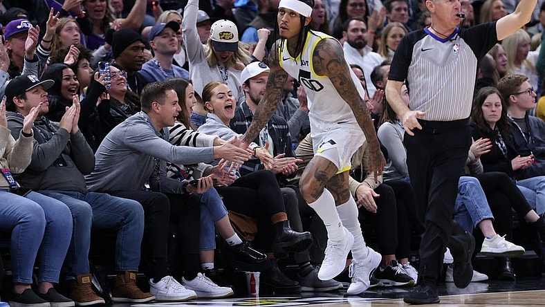 Jan 13, 2024; Salt Lake City, Utah, USA; Utah Jazz guard Jordan Clarkson (00) slaps hands with fans after making a three point basket against the Los Angeles Lakers during the second quarter at Delta Center. Mandatory Credit: Rob Gray-USA TODAY Sports