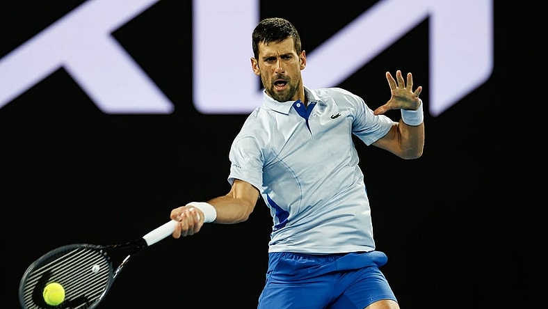 Jan 14, 2024; Melbourne, Victoria, Australia;  Novak Djokovic of Serbia hits a shot against Dino Prizmic of Croatia in the first round of the men   s singles. Mandatory Credit: Mike Frey-USA TODAY Sports