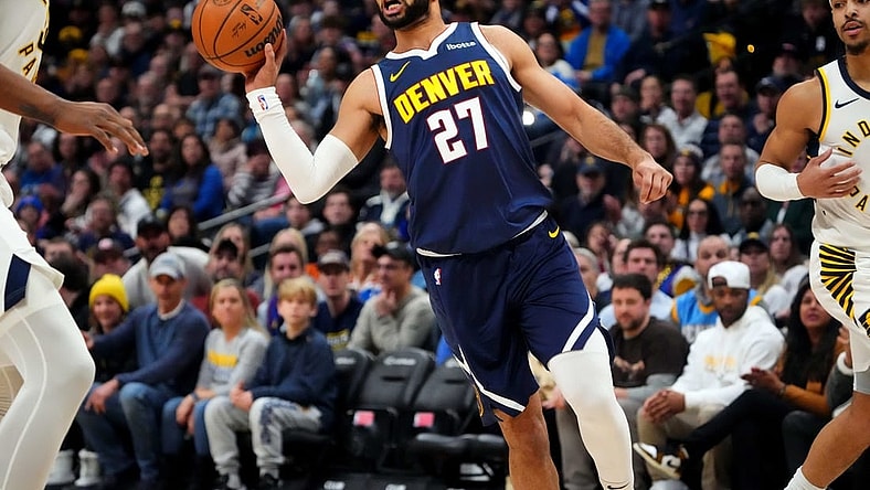 Jan 14, 2024; Denver, Colorado, USA; Denver Nuggets guard Jamal Murray (27) passes the ball in the first quarter against the Indiana Pacers at Ball Arena. Mandatory Credit: Ron Chenoy-USA TODAY Sports